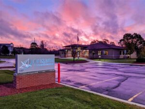 A photo of pink and purple skies over Origami Rehabilitation clinic.