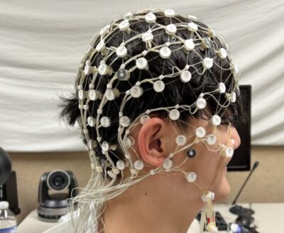 person with wires all over their head/hair