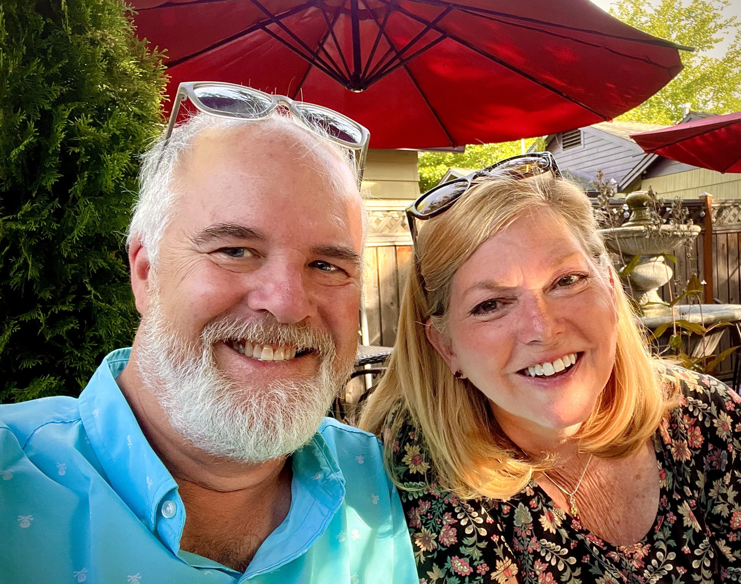 man and woman smiling at outdoor restaurant